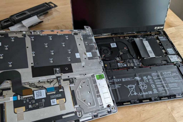 Framework Laptop 13 disassembled with pieces and internal components