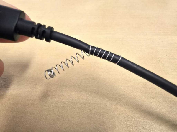 Wrapping a coil around a USB cable.