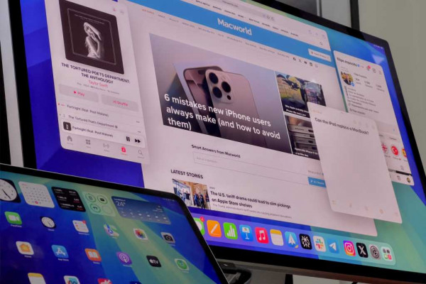 Stage Manager on the iPad mini next to a Mac with an external display