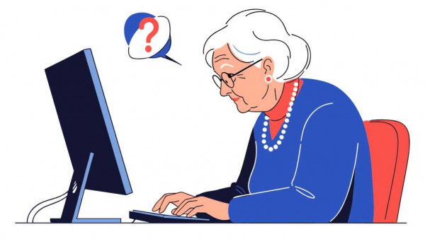 Äldre kvinna vid dator